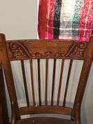 Antique spindle back chair with velvet yellow insert.