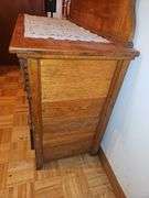 Antique American Eastlake three-drawer oak dresser with a carved mirror