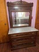 Victorian walnut dresser with a marble top and mirror