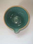 Aqua colored stoneware mixing bowl with spout.
