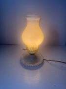 Vintage milk glass table lamp with a ruffled base