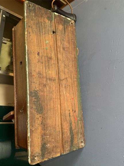 Antique wooden wall-mounted telephone