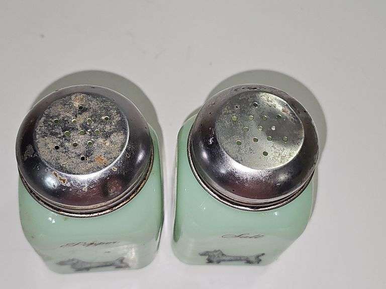 Vintage jadeite pepper shaker with a Scottish Terrier design.