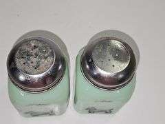 Vintage jadeite pepper shaker with a Scottish Terrier design.