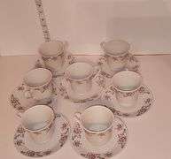 Porcelain tea cups & saucers with rose design