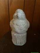 Small shelf and concrete bird