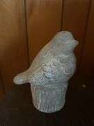 Small shelf and concrete bird