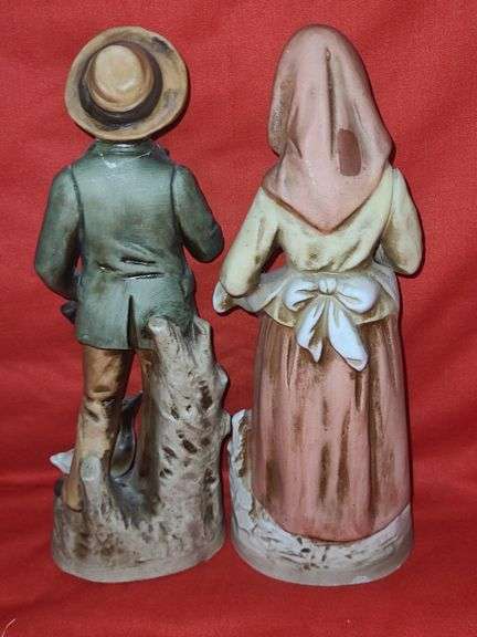 Homci man & woman figurines and little girl figurines.