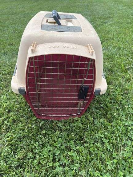 Tan and red dog carrier