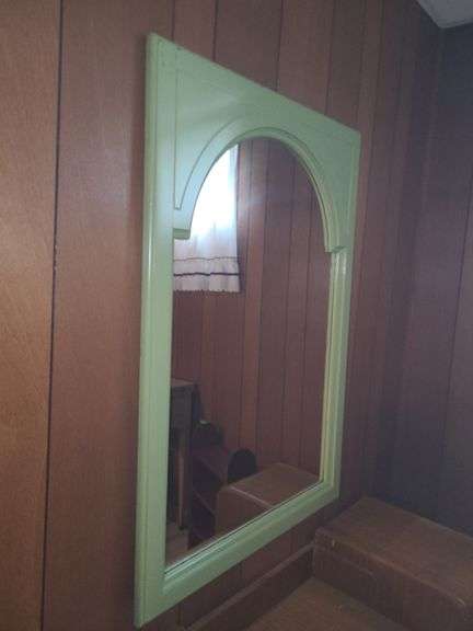 Mirror with green frame