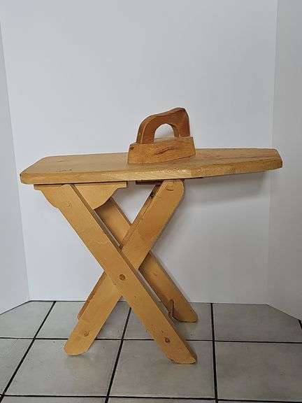 Wooden child's ironing board and iron