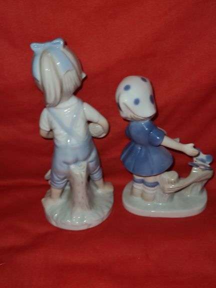 Homci man & woman figurines and little girl figurines.