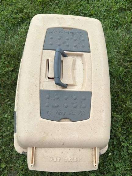 Tan and red dog carrier