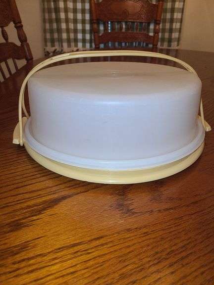 Is Tupperware cake PAN with handle and Tupperware vegetable server.
