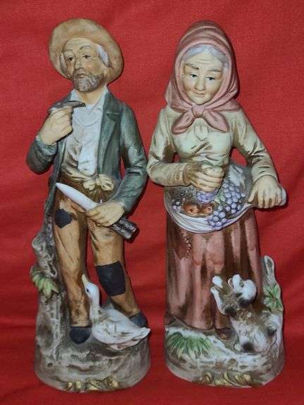 Homci man & woman figurines and little girl figurines.