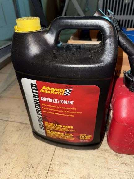 Gas can, Antifreeze,  & box of misc items.