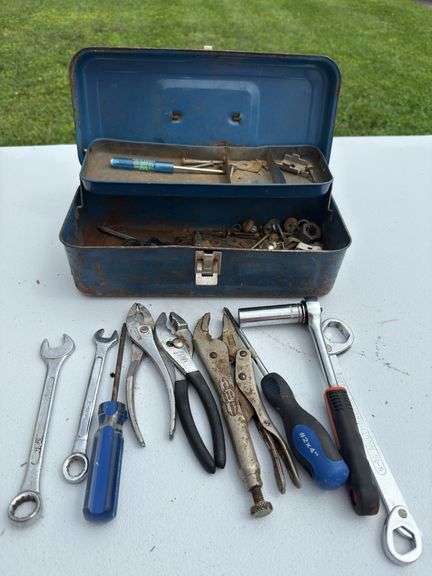 Small vintage metal toolbox and contents.