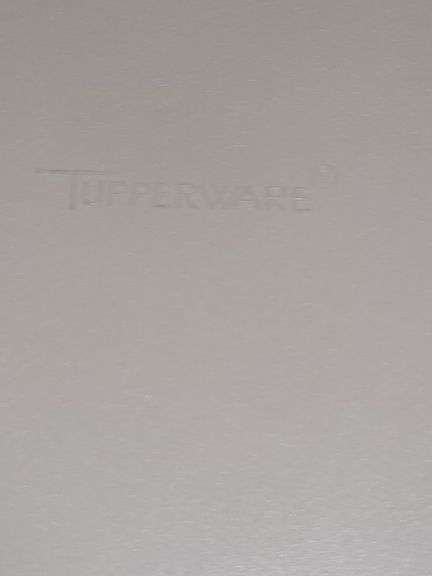 Is Tupperware cake PAN with handle and Tupperware vegetable server.