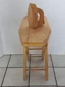 Wooden child's ironing board and iron