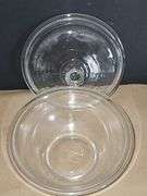 Pyrex bowls with lids & oval bowl with lid in basket