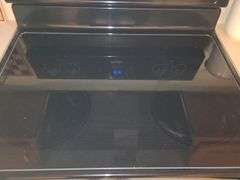 Whirlpool glass top stove.