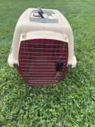 Tan and red dog carrier