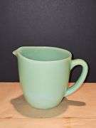 Vintage Fire King Jadeite milk pitcher.