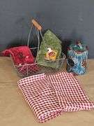 Metal egg basket with farm style linens, and birdhouse.