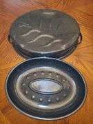 Black and enamel roasting pan with lid.