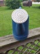 Blue plastic watering can