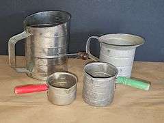 Vintage sifter and measuring cups