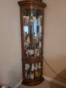 Lighted corner curio cabinet