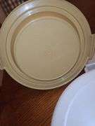 Is Tupperware cake PAN with handle and Tupperware vegetable server.