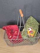 Metal egg basket with farm style linens, and birdhouse.