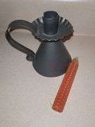 Cast mini iron and tin candle holder with honeycomb candle.