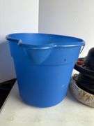 Car buffer in blue bucket