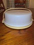 Is Tupperware cake PAN with handle and Tupperware vegetable server.