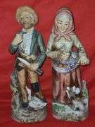 Homci man & woman figurines and little girl figurines.