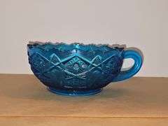Vintage Blue Glass nappy handled bowl Sawtooth rim