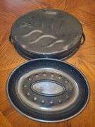 Black and enamel roasting pan with lid.