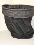 Close tote, toilet paper holder, & metal trash can.