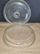 Pyrex bowls with lids & oval bowl with lid in basket