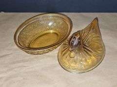 Small amber colored hen on a nest