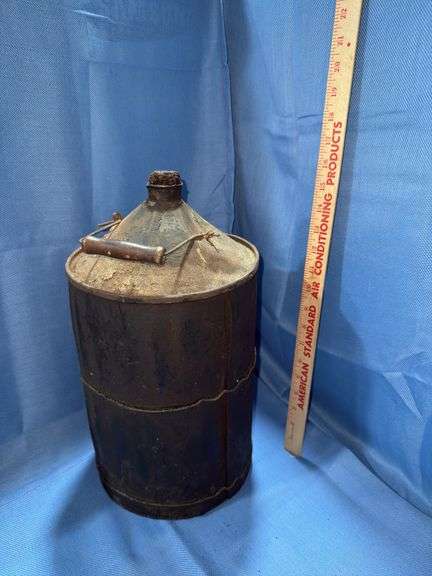 Vintage wood-wrapped metal kerosene or fuel can