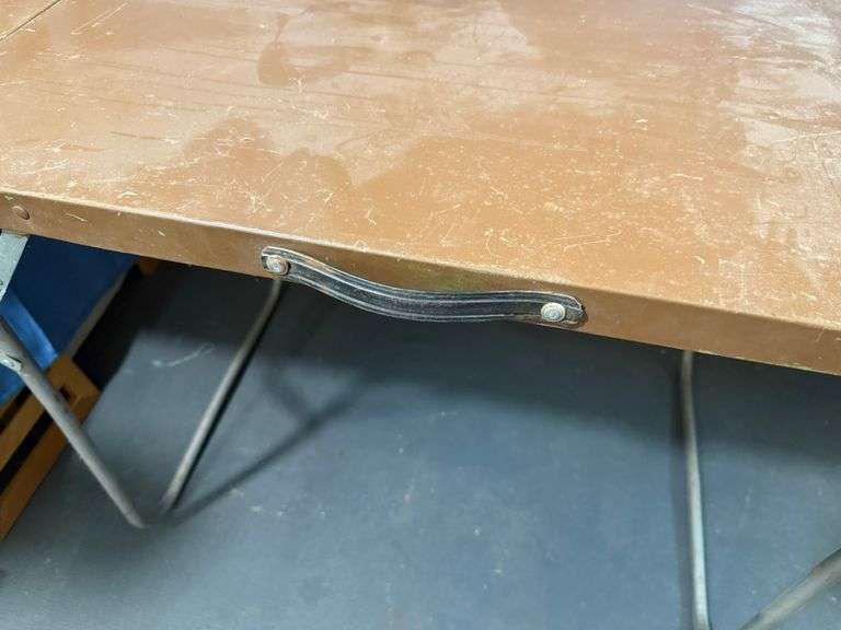 Brown metal folding table
