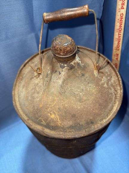 Vintage wood-wrapped metal kerosene or fuel can