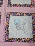 Child's quilt & vintage wooden hanger