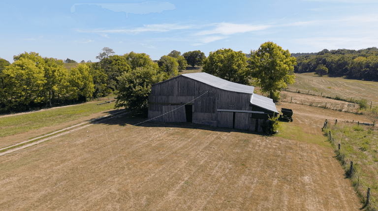 55.4 +/- Acres with 2 Barns