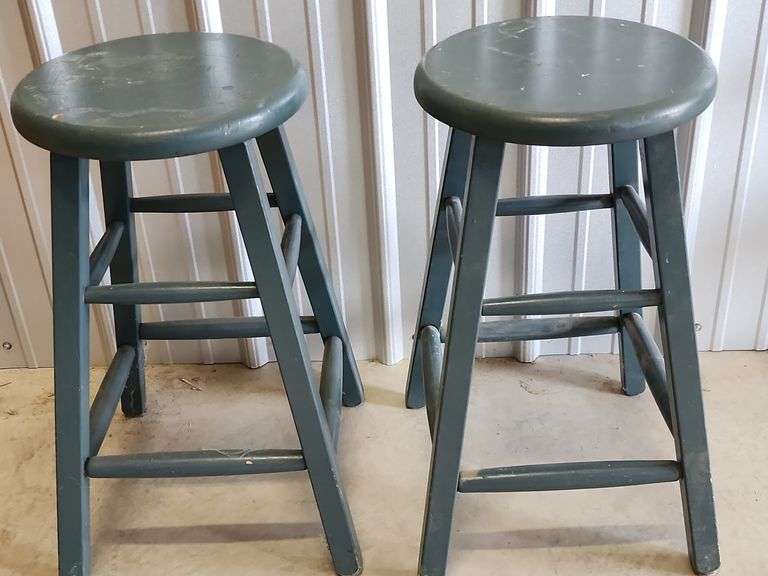 Green wooden stools