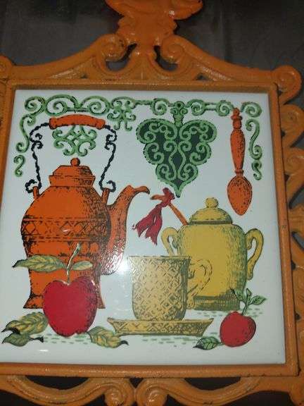 Folk art cast iron and ceramic tile trivets